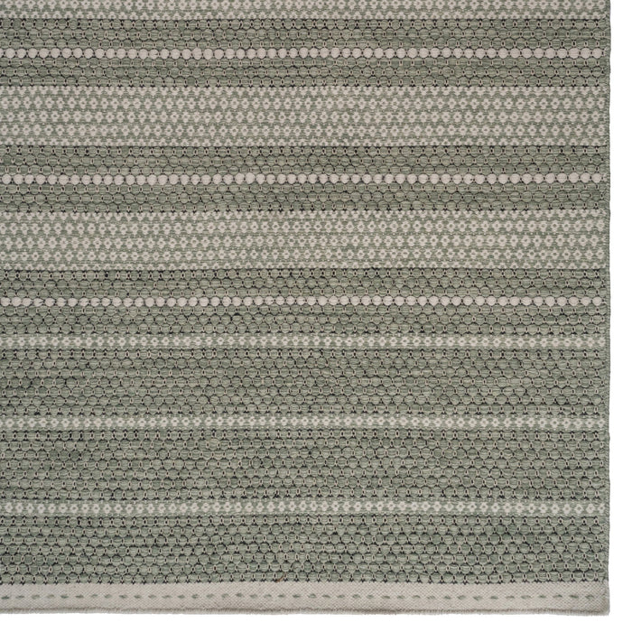 Detailed corner of Alpine Collection Green area rug