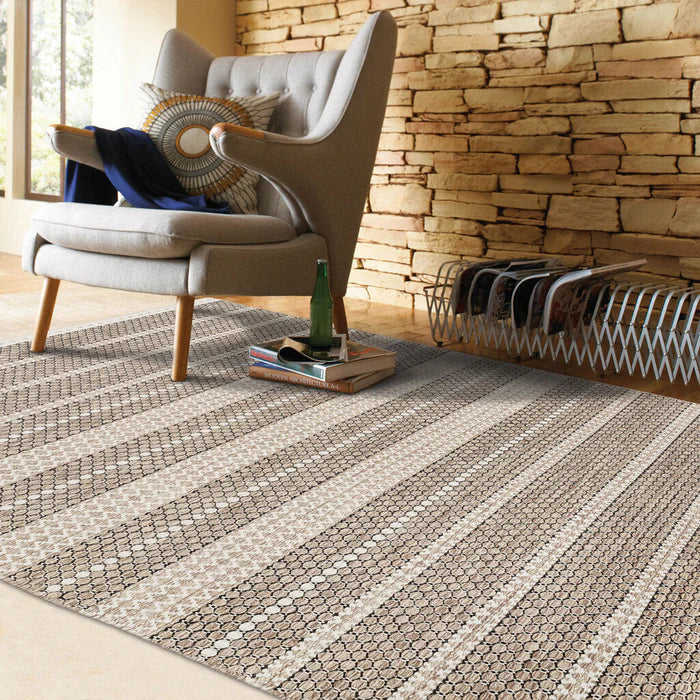 Sand toned, hand woven wool rug from the Alpine collection in living room setting 