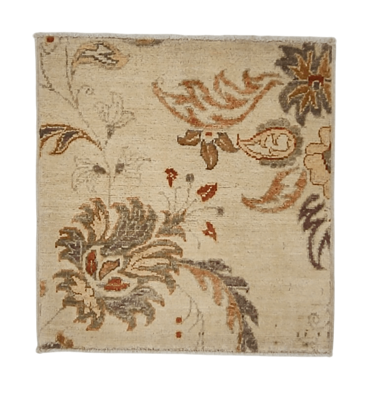 18" square ivory rug features vegetable-dyed wool with luxurious silk accents